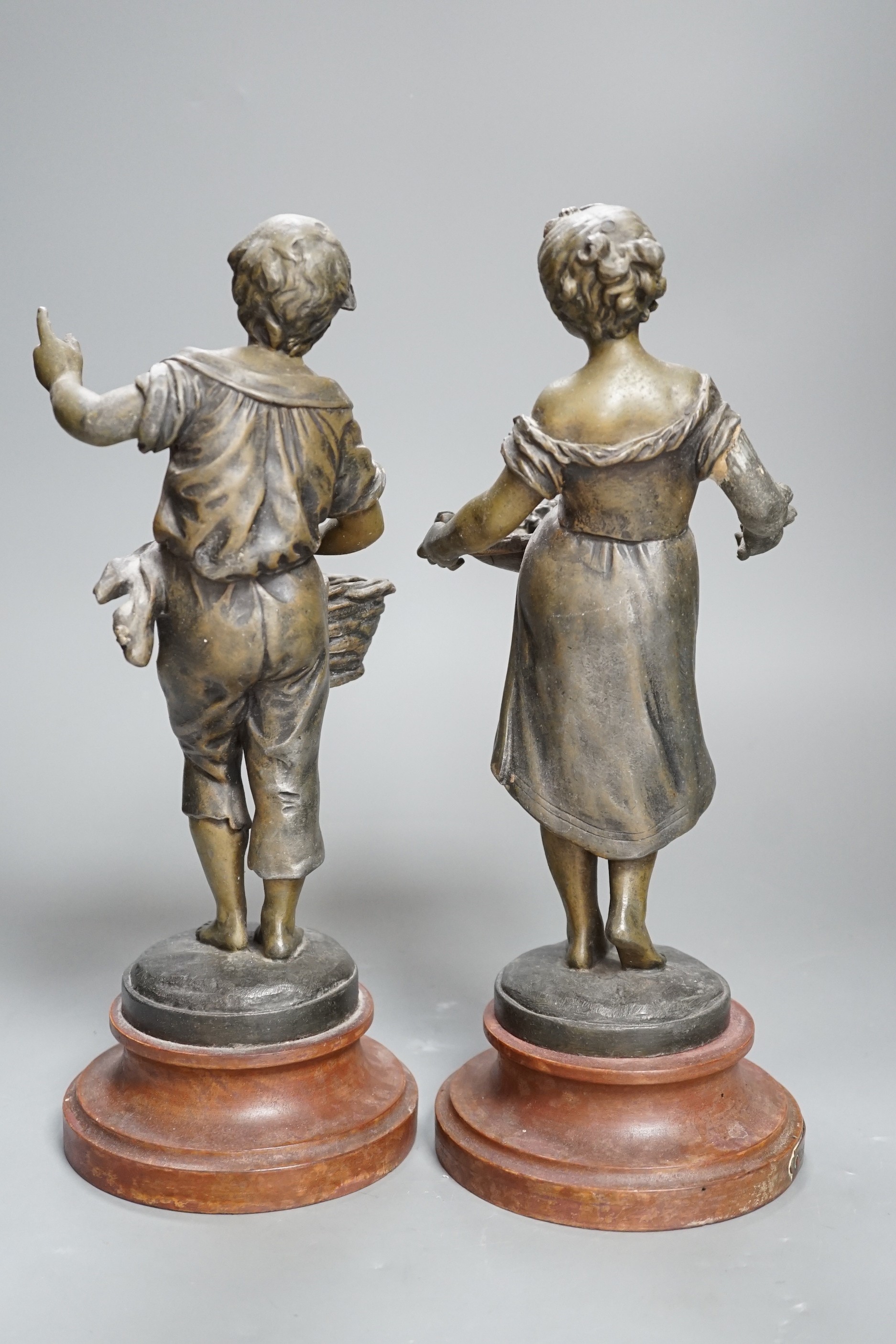 A pair of French spelter figures ‘Les Cerises’ and ‘Les Roses’. 29cm tall.